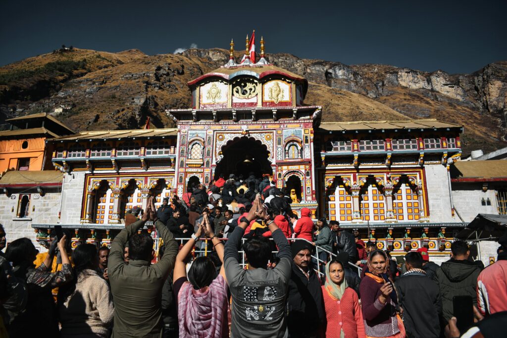 Crowd of devotees gathered at Badrinath Temple, India, embracing spirituality.